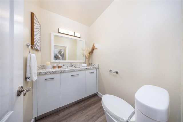 2122 Meteora Way, Rowland Heights, CA 91748 - bathroom featuring toilet, vanity, wood finished floors, and baseboards