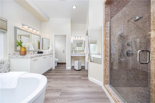 2122 Meteora Way, Rowland Heights, CA 91748 - full bath featuring a shower stall, vanity, toilet, a freestanding bath, and wood finished floors