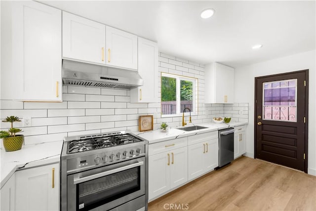 9324 Rhea Ave, Northridge, CA 91324 - kitchen featuring stainless steel appliances, under cabinet range hood, a sink, white cabinets, and recessed lighting