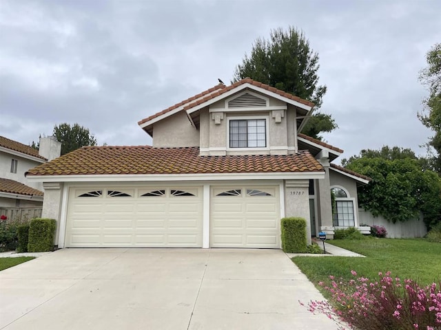 39787 Castile Ave, Murrieta, CA 92562 - mediterranean / spanish-style house with driveway, stucco siding, and a tile roof