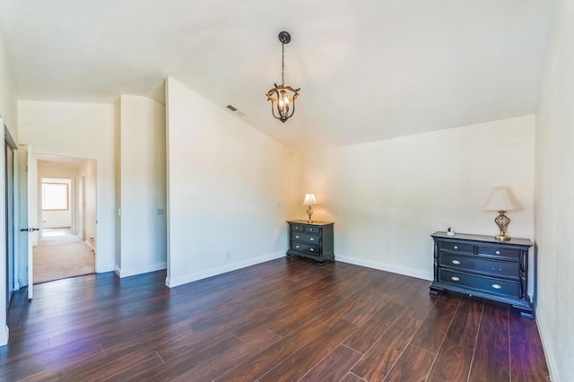 39787 Castile Ave, Murrieta, CA 92562 - unfurnished living room featuring dark wood-style floors, a chandelier, and lofted ceiling