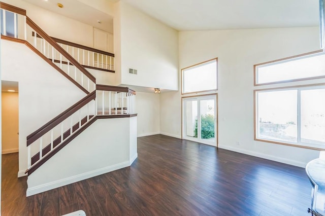 39787 Castile Ave, Murrieta, CA 92562 - foyer with high vaulted ceiling, stairs, and dark wood-style flooring
