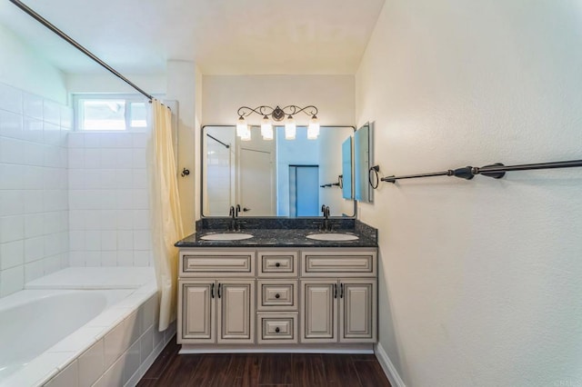39787 Castile Ave, Murrieta, CA 92562 - bathroom with double vanity, wood finished floors, and tiled shower / bath