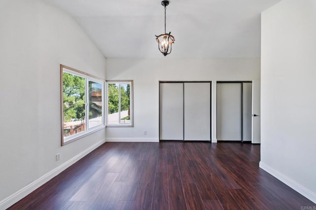 39787 Castile Ave, Murrieta, CA 92562 - spare room featuring dark wood-style floors, a chandelier, and lofted ceiling