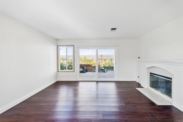 39787 Castile Ave, Murrieta, CA 92562 - unfurnished living room featuring a high end fireplace and dark wood-style flooring