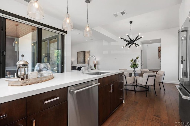 731 Valley Ave, Solana Beach, CA 92075 - kitchen featuring dishwasher, light countertops, dark wood finished floors, and dark brown cabinetry