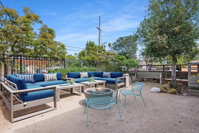731 Valley Ave, Solana Beach, CA 92075 - fenced backyard with an outdoor living space with a fire pit and a patio area