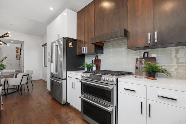 731 Valley Ave, Solana Beach, CA 92075 - kitchen with appliances with stainless steel finishes, light countertops, dark wood-type flooring, white cabinetry, and recessed lighting