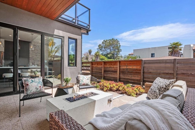 731 Valley Ave, Solana Beach, CA 92075 - fenced backyard featuring an outdoor living space with a fire pit and a patio area