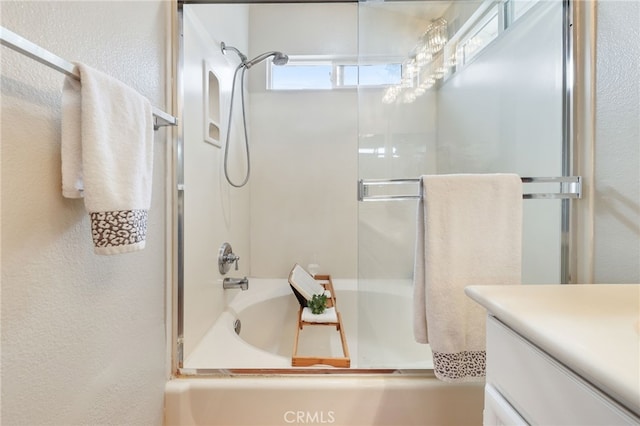 1263 Date Palm Dr, Carson, CA 90746 - bathroom with a textured wall, vanity, and shower / bath combination with glass door