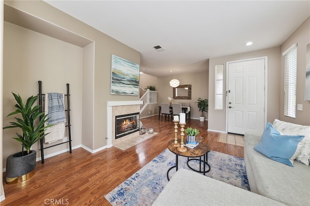 1263 Date Palm Dr, Carson, CA 90746 - living area featuring wood finished floors, baseboards, recessed lighting, and a tile fireplace