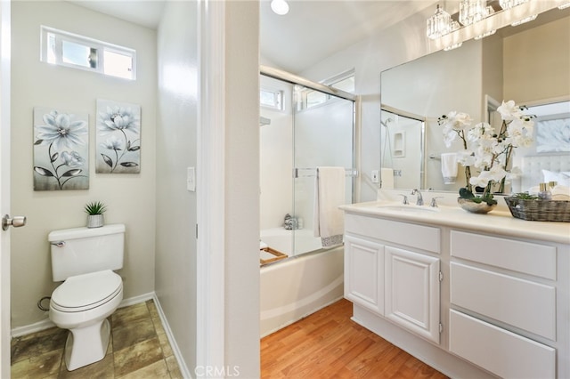1263 Date Palm Dr, Carson, CA 90746 - bathroom featuring vanity, toilet, enclosed tub / shower combo, and baseboards