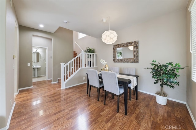 1263 Date Palm Dr, Carson, CA 90746 - dining room featuring stairs, wood finished floors, baseboards, and recessed lighting