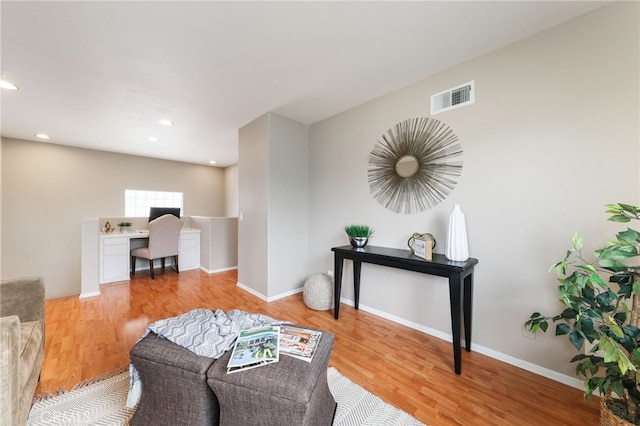 1263 Date Palm Dr, Carson, CA 90746 - living area featuring light wood-style flooring, a desk, recessed lighting, and baseboards