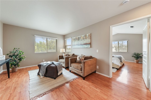 1263 Date Palm Dr, Carson, CA 90746 - living area featuring light wood finished floors, baseboards, and lofted ceiling
