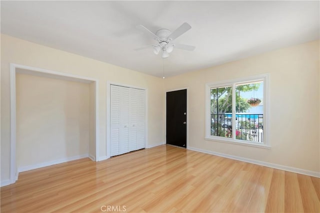451 N Indiana St, Los Angeles, CA 90063 - unfurnished bedroom with light wood-style flooring, baseboards, and a ceiling fan