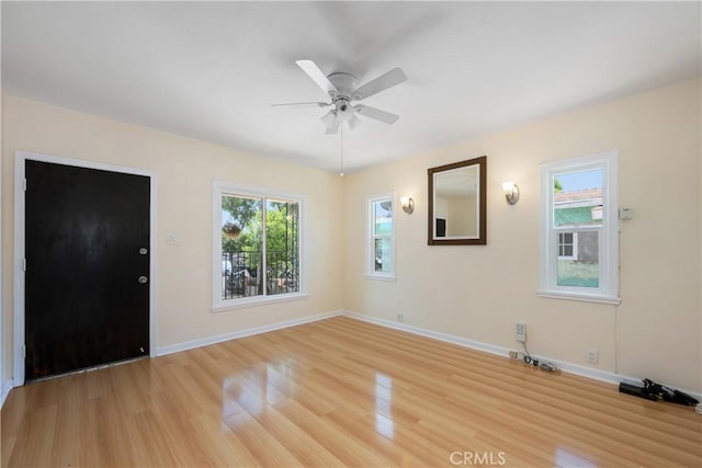 451 N Indiana St, Los Angeles, CA 90063 - entryway with light wood-style flooring, ceiling fan, and baseboards