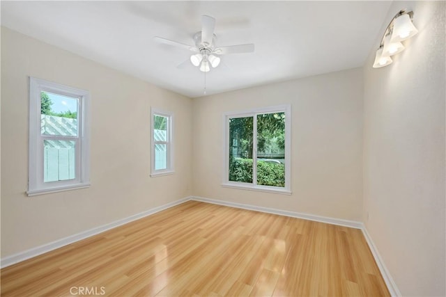 451 N Indiana St, Los Angeles, CA 90063 - empty room with light wood finished floors, baseboards, and ceiling fan