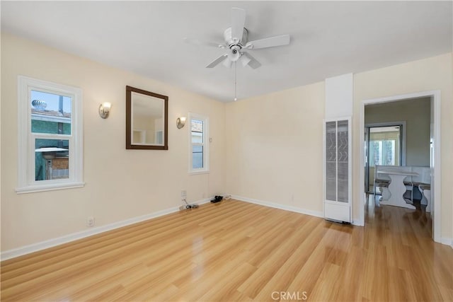 451 N Indiana St, Los Angeles, CA 90063 - spare room with light wood-type flooring, healthy amount of natural light, baseboards, and ceiling fan