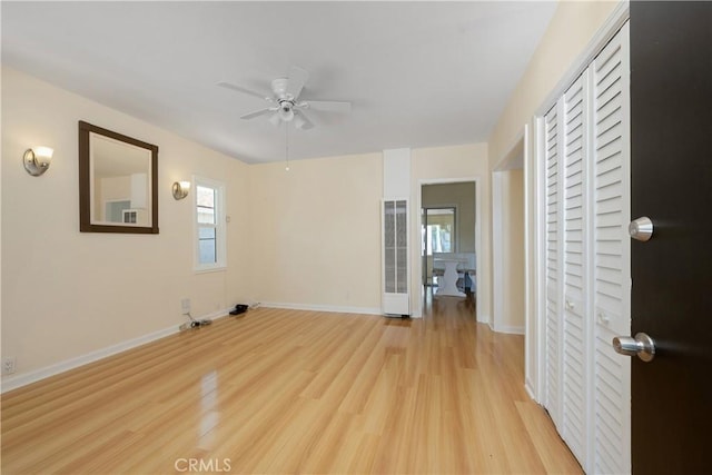 451 N Indiana St, Los Angeles, CA 90063 - spare room featuring a ceiling fan, light wood-style flooring, and baseboards