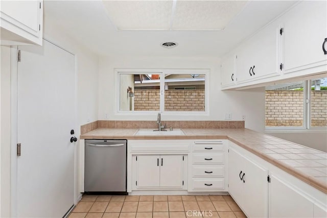 7879 Camino Predera, Rancho Cucamonga, CA 91730 - kitchen with dishwasher, a sink, white cabinets, tile countertops, and light tile patterned flooring