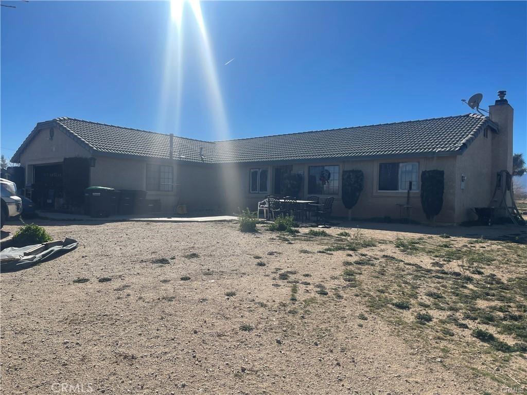 12238 Windermere Rd, Phelan, CA 92371 - rear view of property with a tiled roof and a chimney