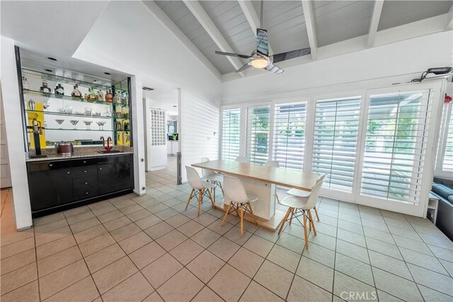 2110 Hathaway Pl, Riverside, CA 92506 - dining space with bar with sink, light tile patterned floors, beamed ceiling, a ceiling fan, and plenty of natural light