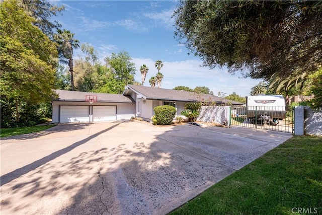 2110 Hathaway Pl, Riverside, CA 92506 - ranch-style house featuring driveway, a gate, an attached garage, and stucco siding
