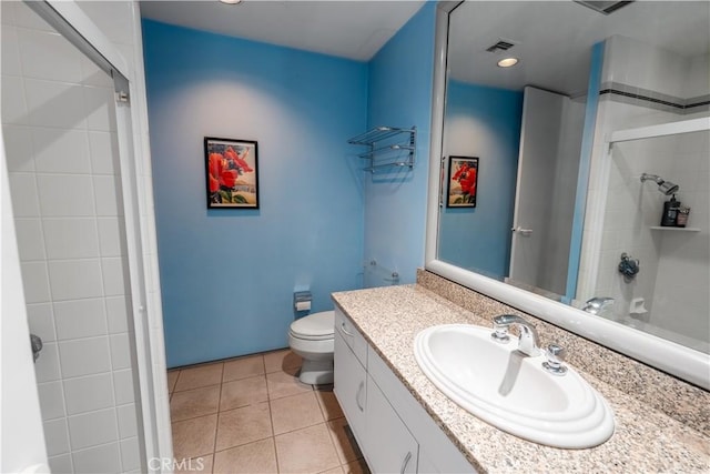 2110 Hathaway Pl, Riverside, CA 92506 - bathroom featuring a shower with door, tile patterned floors, toilet, vanity, and recessed lighting