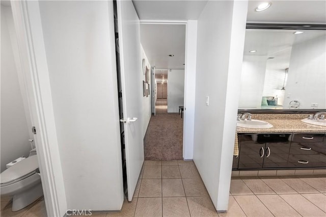 2110 Hathaway Pl, Riverside, CA 92506 - full bathroom featuring toilet, double vanity, and tile patterned flooring