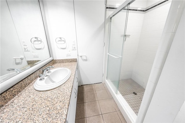 2110 Hathaway Pl, Riverside, CA 92506 - bathroom with a stall shower, vanity, and tile patterned flooring