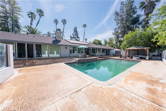 2110 Hathaway Pl, Riverside, CA 92506 - view of swimming pool with a gazebo, a patio area, an outdoor living space, and a fenced backyard