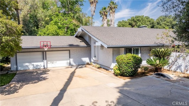 2110 Hathaway Pl, Riverside, CA 92506 - ranch-style house featuring a garage, driveway, and roof with shingles