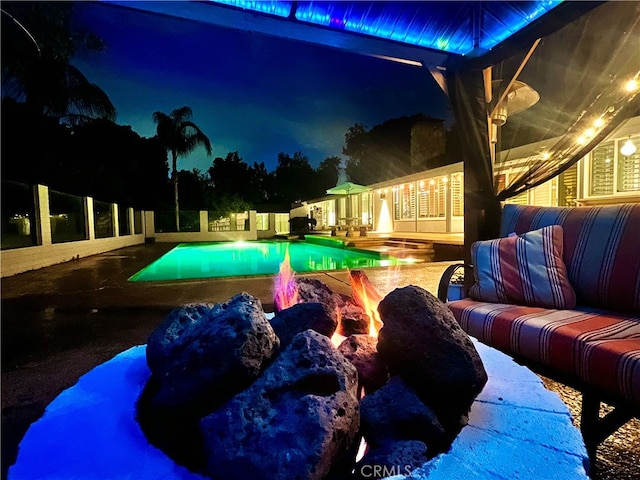 2110 Hathaway Pl, Riverside, CA 92506 - pool at night featuring a patio