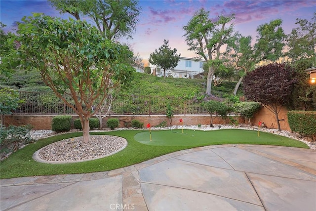 3612 Skylark Way, Brea, CA 92823 - yard at dusk with a putting green, a fenced backyard, and a patio area