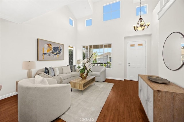 3612 Skylark Way, Brea, CA 92823 - living area with a chandelier, wood finished floors, baseboards, and a towering ceiling
