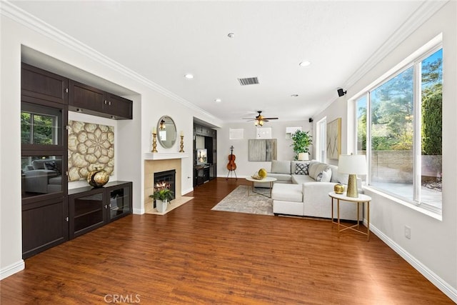 3612 Skylark Way, Brea, CA 92823 - living area featuring a fireplace with flush hearth, dark wood-style flooring, crown molding, a ceiling fan, and recessed lighting