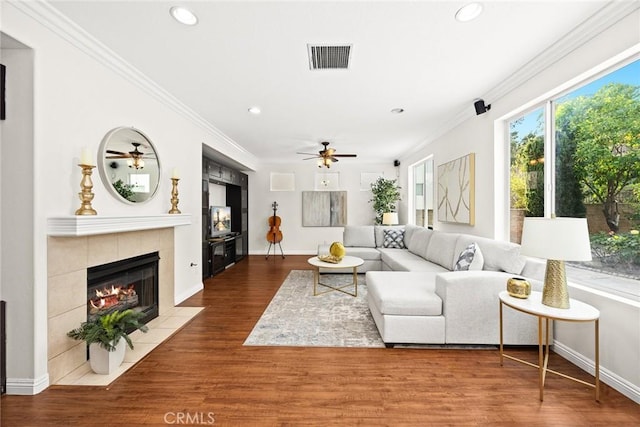 3612 Skylark Way, Brea, CA 92823 - living room featuring a ceiling fan, wood finished floors, recessed lighting, a tiled fireplace, and ornamental molding