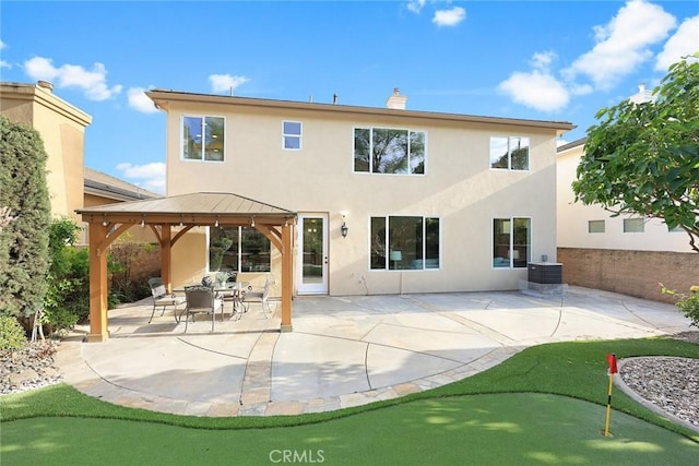 3612 Skylark Way, Brea, CA 92823 - back of house with a putting area, a gazebo, stucco siding, and a patio area