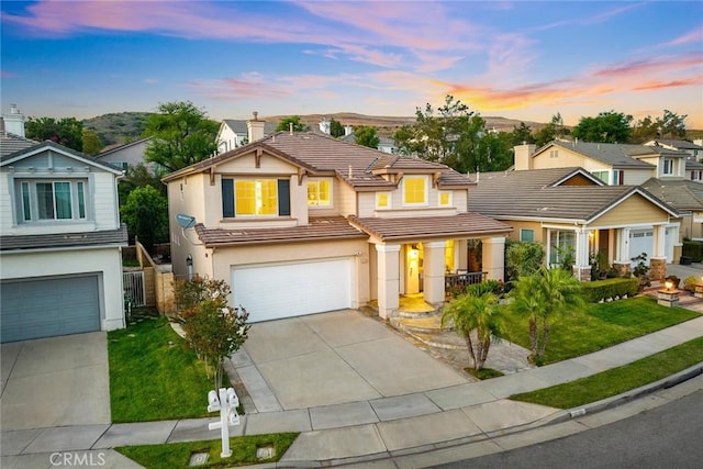 3612 Skylark Way, Brea, CA 92823 - traditional-style home with a tile roof, an attached garage, concrete driveway, stucco siding, and a chimney