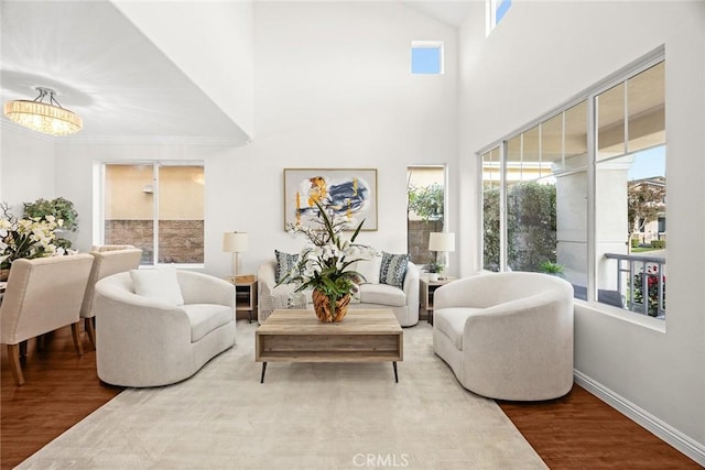 3612 Skylark Way, Brea, CA 92823 - living area featuring wood finished floors, healthy amount of natural light, and a chandelier