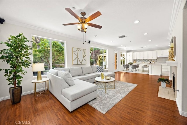 3612 Skylark Way, Brea, CA 92823 - living area with ornamental molding, ceiling fan, wood finished floors, recessed lighting, and baseboards