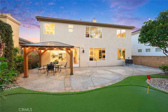 3612 Skylark Way, Brea, CA 92823 - back of house featuring a putting area, a gazebo, a patio area, and stucco siding