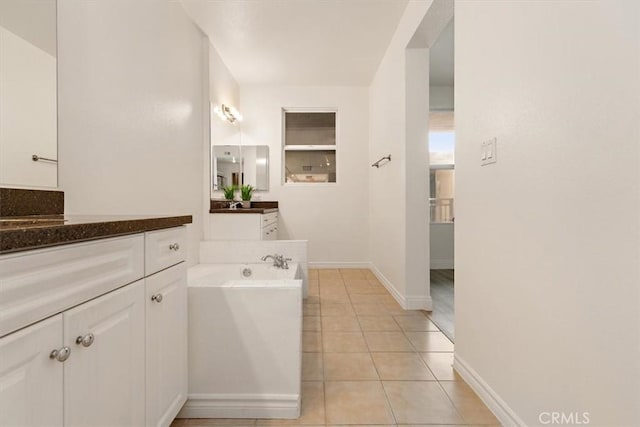 89 E Commonwealth Ave Unit 1I, Alhambra, CA 91801 - full bathroom featuring vanity, a garden tub, tile patterned floors, and baseboards