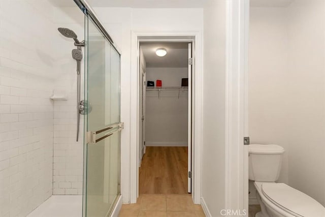 89 E Commonwealth Ave Unit 1I, Alhambra, CA 91801 - bathroom with a shower stall, a spacious closet, and toilet