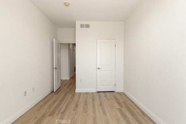 89 E Commonwealth Ave Unit 1I, Alhambra, CA 91801 - unfurnished bedroom featuring light wood-type flooring and baseboards