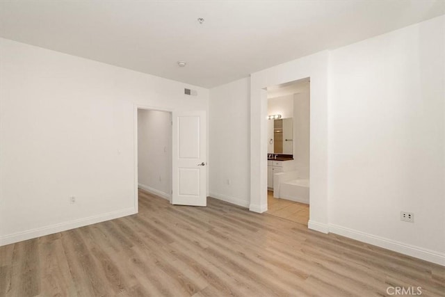 89 E Commonwealth Ave Unit 1I, Alhambra, CA 91801 - unfurnished room with light wood finished floors, baseboards, and fire sprinkler in ceiling
