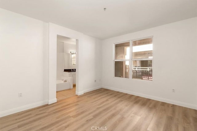 89 E Commonwealth Ave Unit 1I, Alhambra, CA 91801 - empty room with baseboards and light wood-style flooring