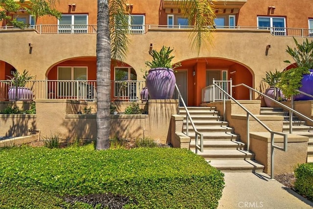89 E Commonwealth Ave Unit 1I, Alhambra, CA 91801 - view of front of property featuring stucco siding and stairway