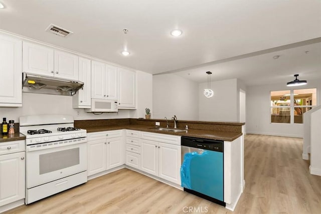 89 E Commonwealth Ave Unit 1I, Alhambra, CA 91801 - kitchen with white appliances, under cabinet range hood, dark countertops, light wood-type flooring, and a peninsula